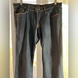 Flying Monkey dark blue jeans finished with orange stitch. Very cute. Size 29